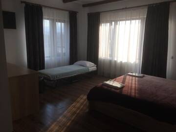 Фото номера Стандартный номер с кроватью размера &quot;king-size&quot; Отель Pensiunea Casa Lupas г. Джилэу 12